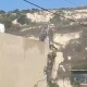 الاحتلال يهدم 12 مخزنا تجاريا على مدخل قرية عنزا جنوب جنين